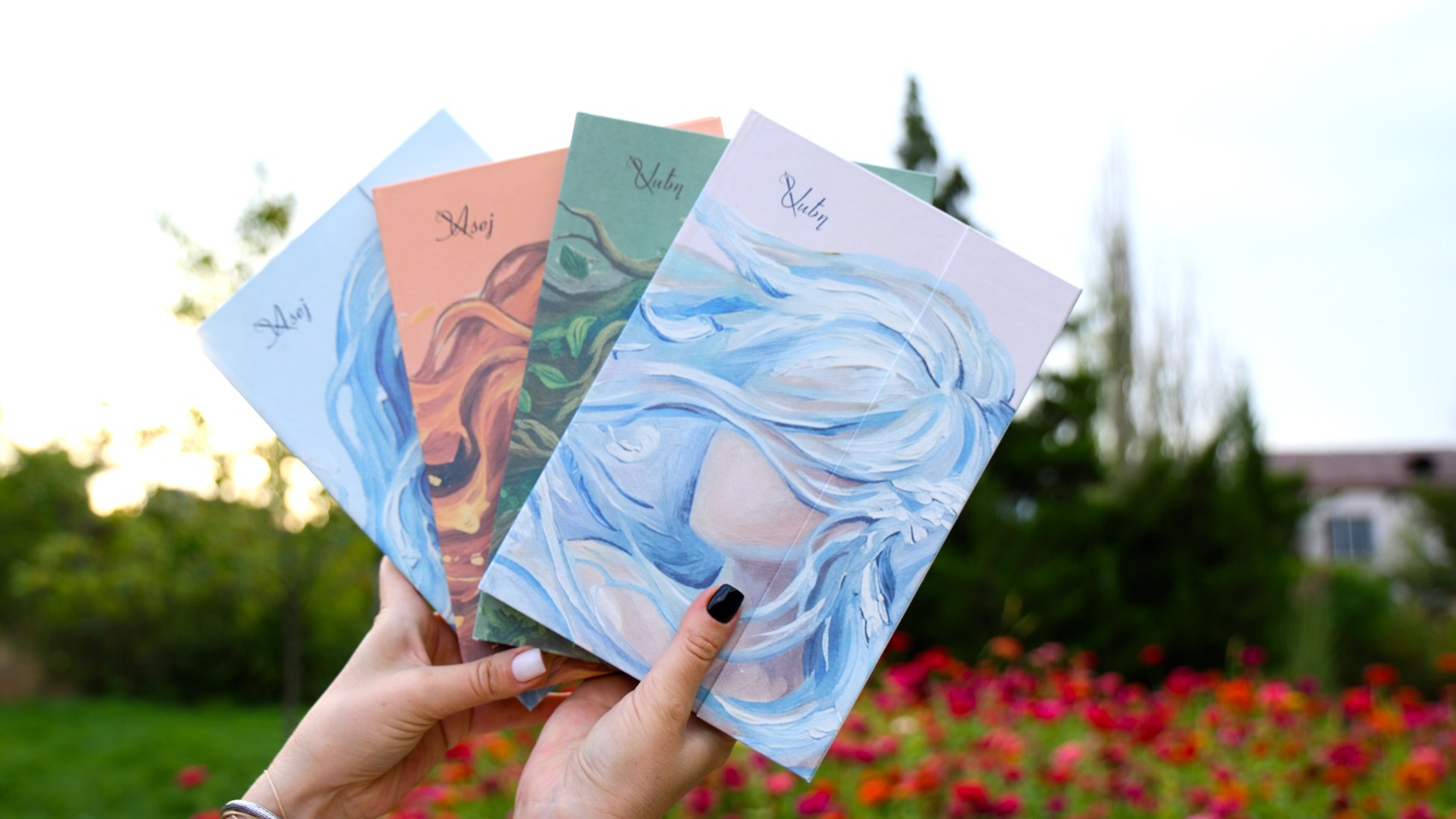 Las cuatro agendas ASEJ juntas, con las ilustraciones de Agua, Fuego, Tierra y Aire